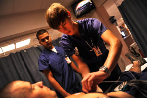 med student doing physical exam