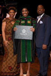 Dr. Latomore at her med school graduation with her parents