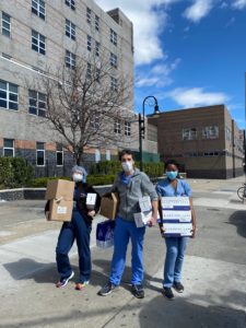Residents moving medical supplies into the hospital