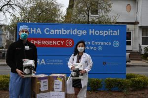 Frances and another resident unload N95 masks at CHA