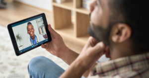 patient and doctor in virtual visit on Ipad